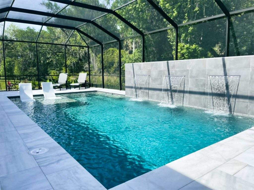 Custom pool with raised wall waterfalls in Palm Coast