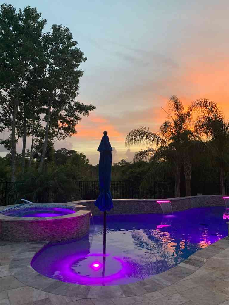 Custom pool and spa combo with colored LED lighting