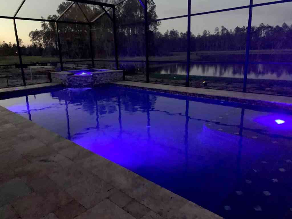 Inground pool with colored LED lighting in Palm  Coast