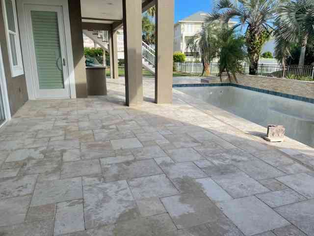 Pool remodel with travertine deck