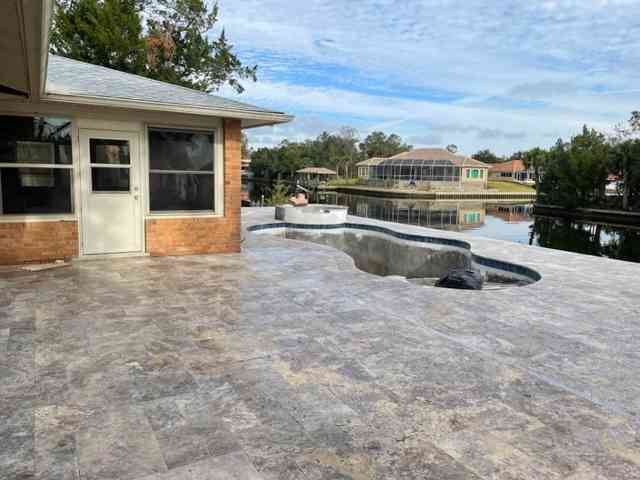 Travertine pool deck complete