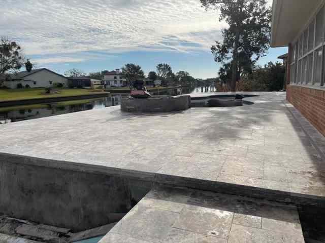 Travertine pool deck complete