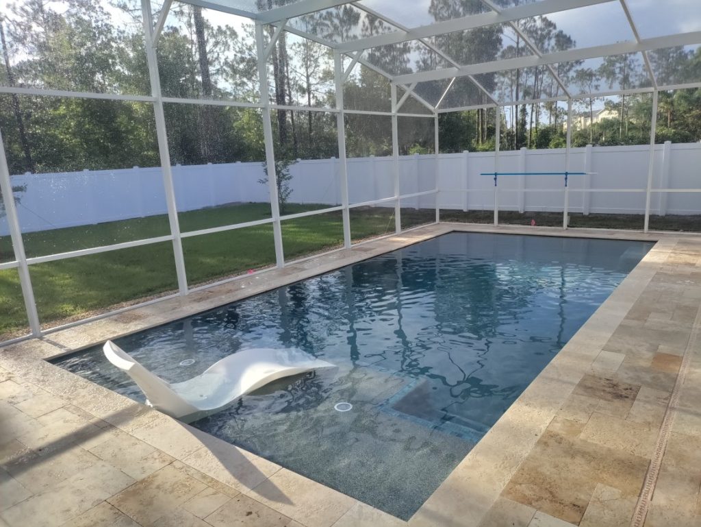 Gunite pool with sun shelf in Palm Coast ready to be enjoyed.