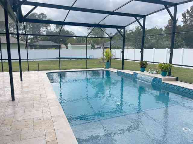 New custom pool in Palm Coast with screen enclosure