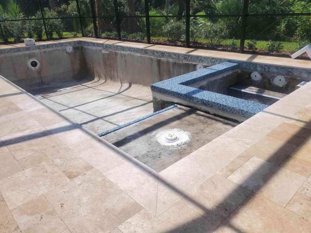 Custom gunite pool construction in Palm Coast with flush spa and sun deck