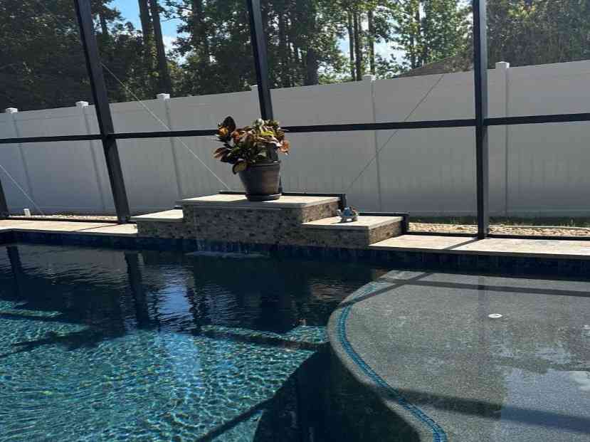 Raised wall water feature in custom pool built in Palm Coast