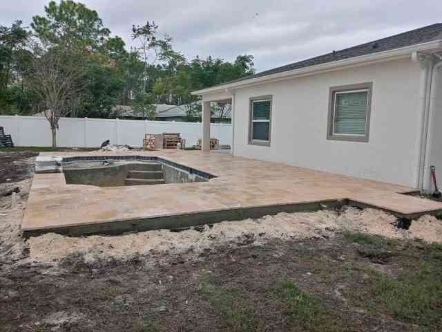 travertine pavers over concrete sub deck
