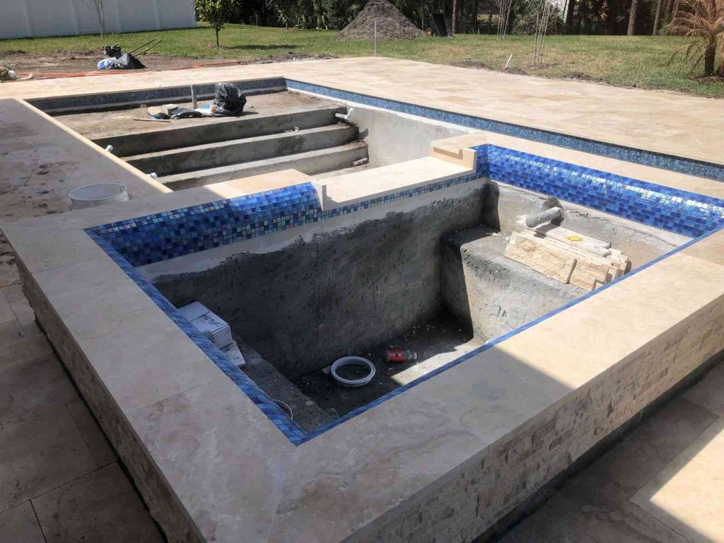 raised spa with spillover and rolled-edge