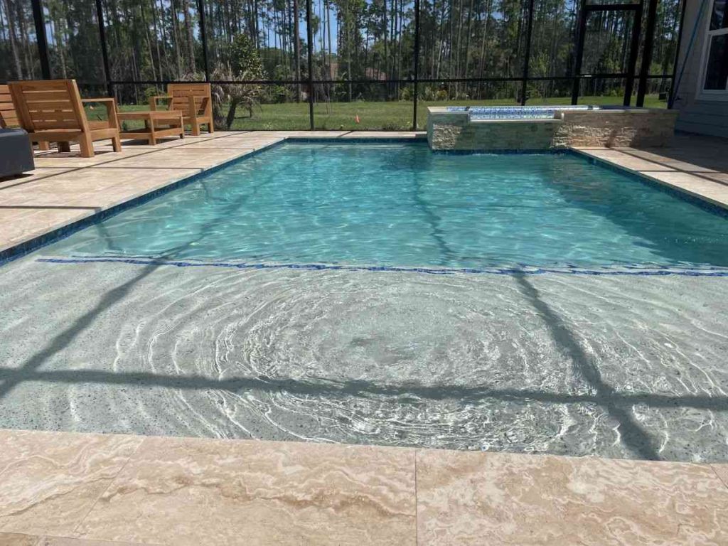 custom pool with raised spa and sun shelf in Palm Coast's P-section