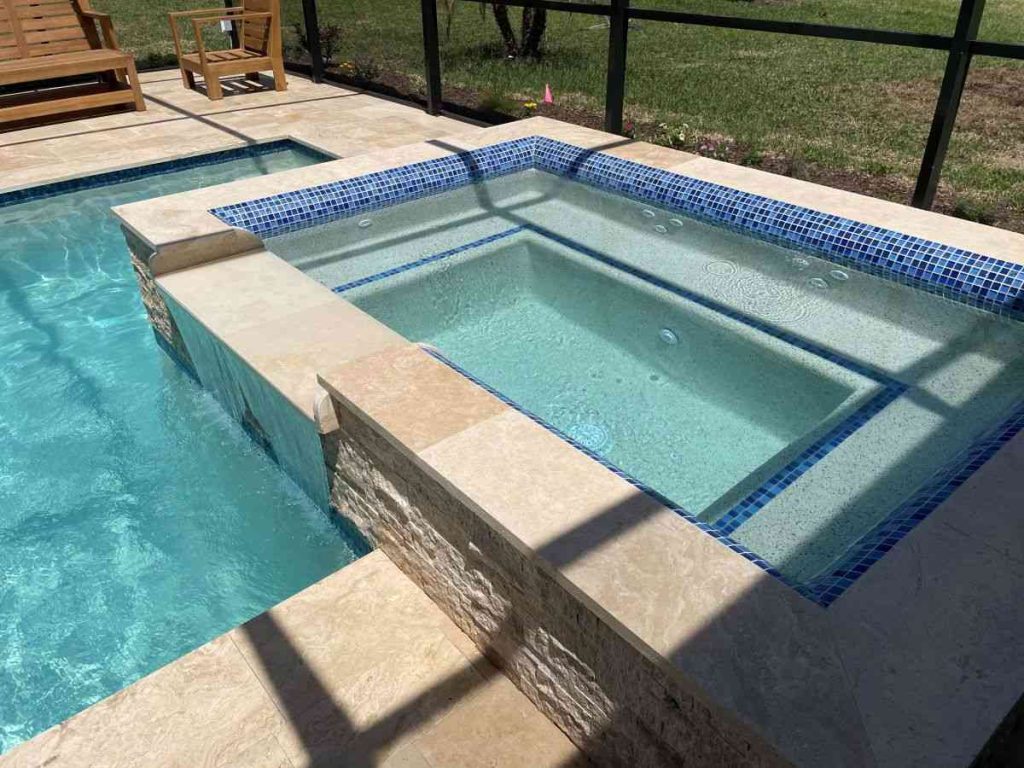 custom pool with raised spa and sun shelf in Palm Coast's P-section