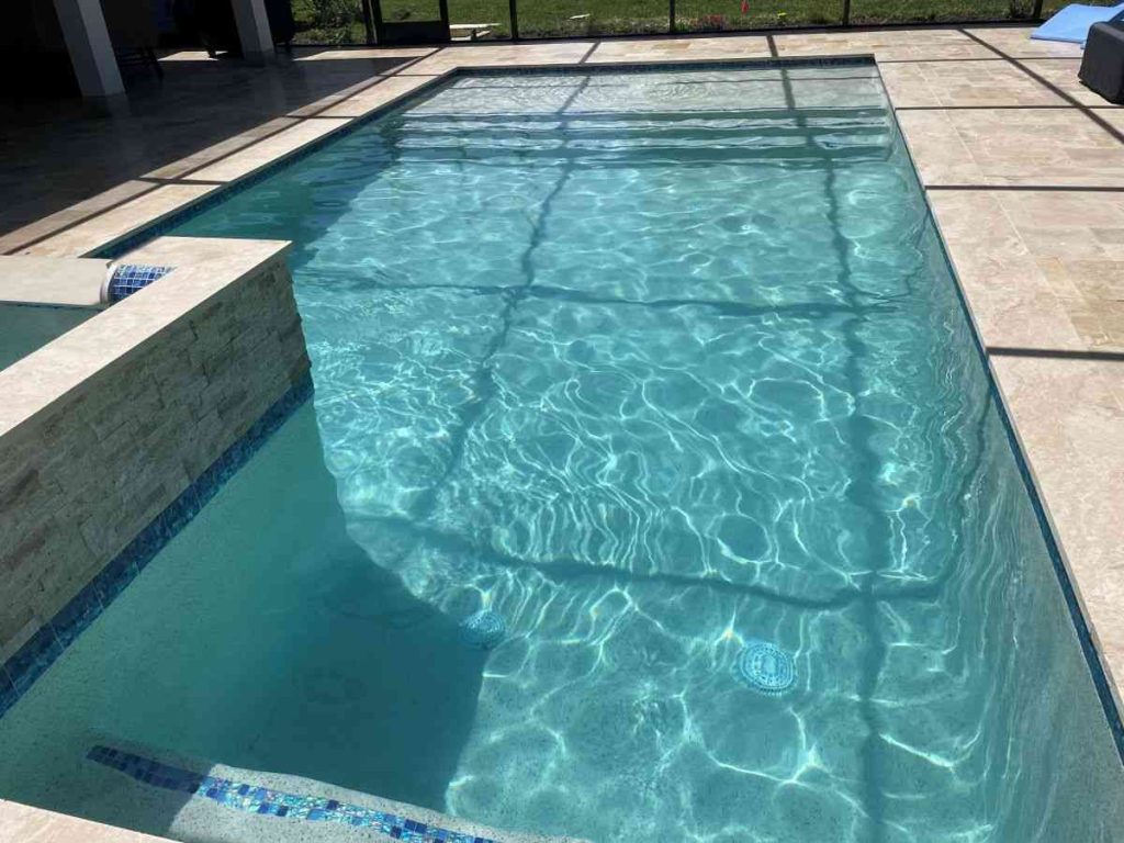custom pool with raised spa and sun shelf in Palm Coast's P-section