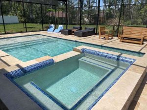 custom pool with raised spa and sun shelf in Palm Coast's P-section