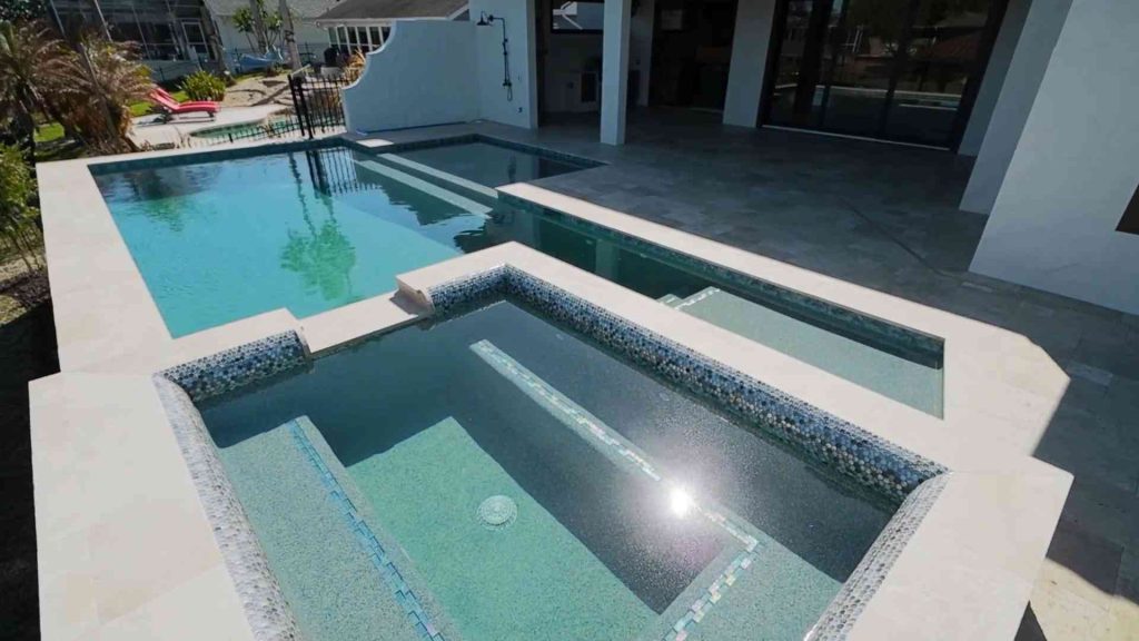 Custom waterfront pool with spa construction in Palm Coast's C section