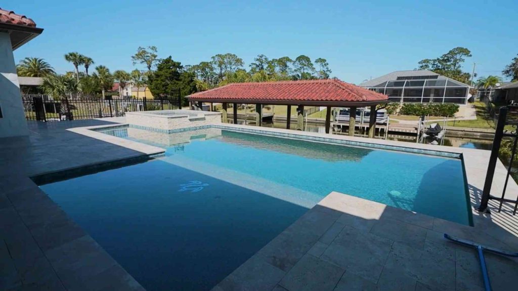 Custom waterfront pool with spa construction in Palm Coast's C section