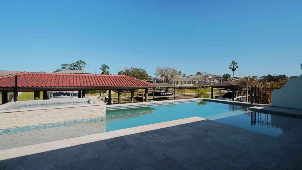 Custom waterfront pool with spa construction in Palm Coast's C section