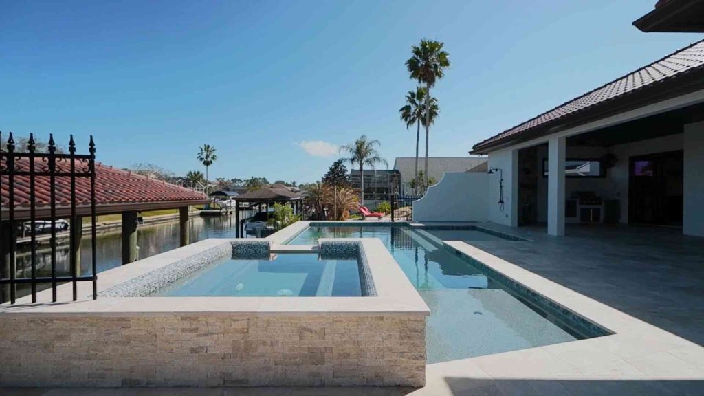 Custom waterfront pool with spa construction in Palm Coast's C section