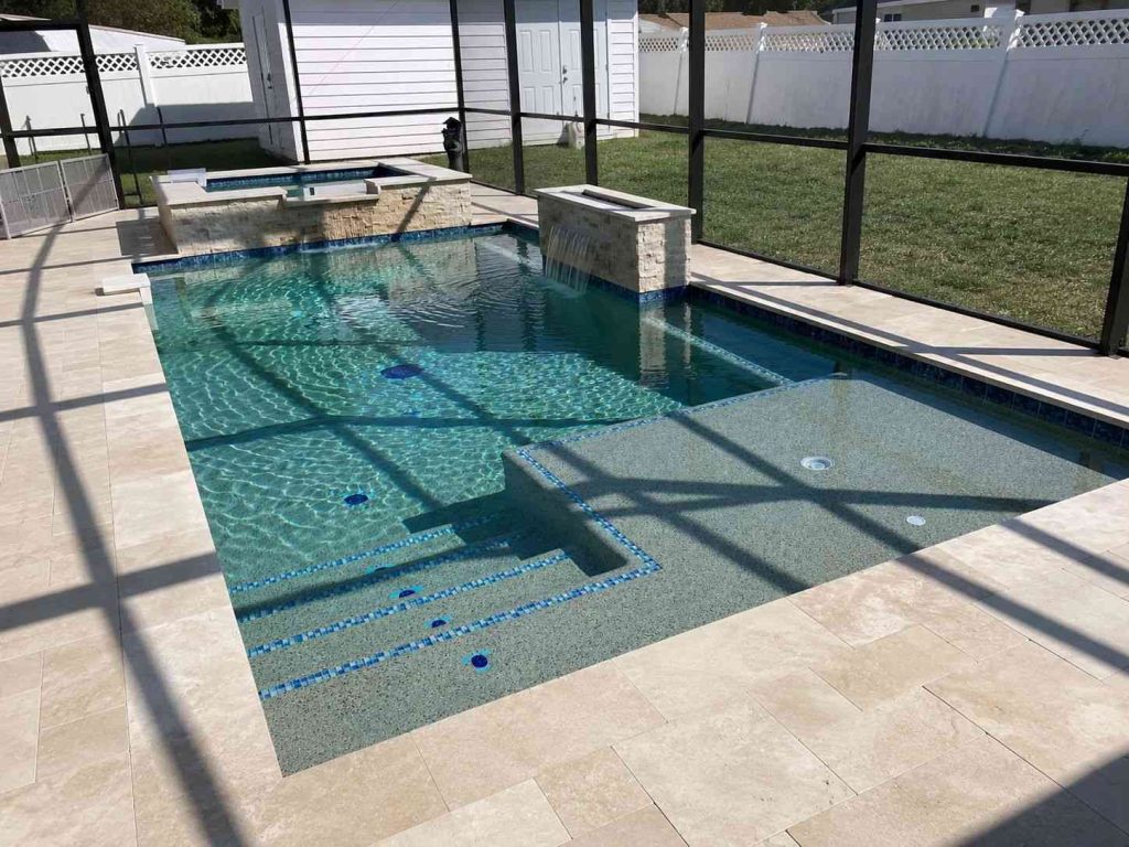 Custom pool with raised spa and waterfall features in Palm Coast's P section