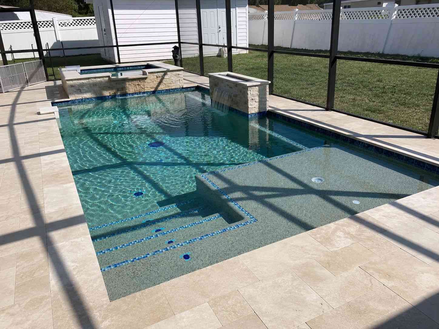 Custom pool with raised spa and waterfall features in Palm Coast's P section
