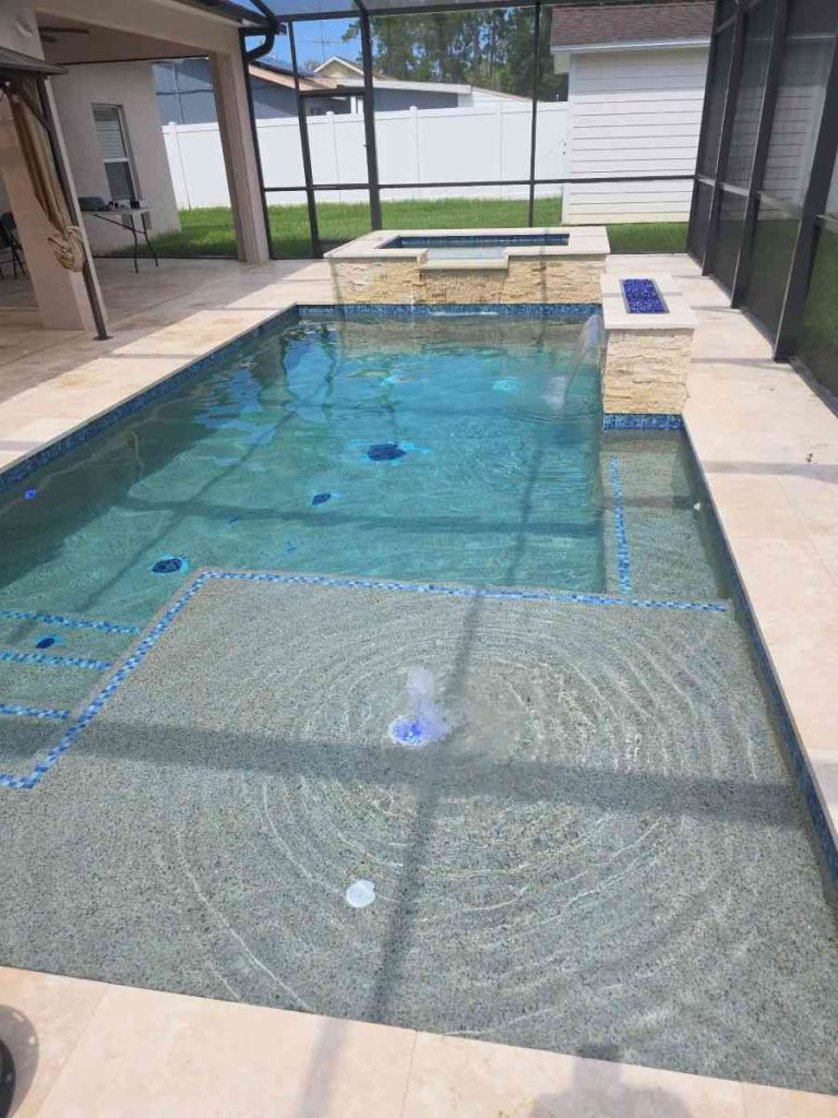 Sun shelf view of this custom pool and spa in Palm Coast's P section